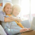 Older couple using a laptop at home