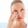 Woman rubbing her irritated eye