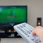 Remote control pointed at a television