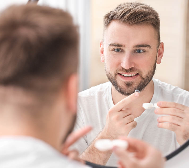 Man Putting in Contact Lenses