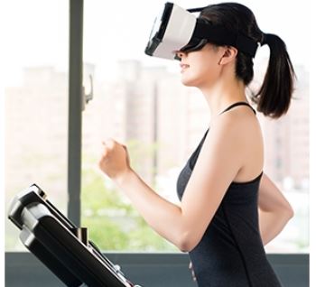 Woman wearing VR glasses on a treadmill